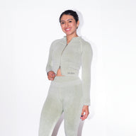 Woman wearing MAMMA MIA zip long sleeve top GUGA, front view, athletic design with zipper